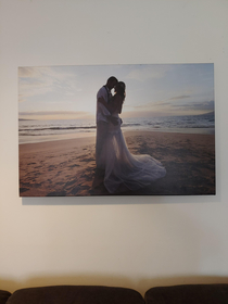 This is a picture of two of my best friends on their wedding day in Hawaii They got divorced shortly after and now I display it as hotel art in my living room