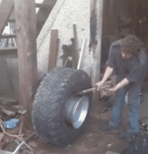 This is the manliest way to put the tire on the rim I have ever seen