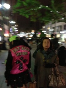 This Japanese woman and her daughter were walking around downtown With a FANTASTIC jacket