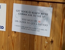 This Local tattoo studio has a sign at the reception counter