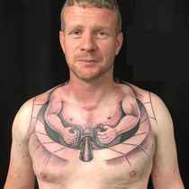 This mans chest tattoo