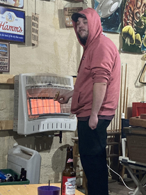 This picture of this motheramp trying to heat up his cold pizza by standing next to our space heater in the garage made my fiancs poker night completely worth it even though he lost money