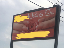 This salons sign in my town is definitely just a picture of fingernails and a rose right