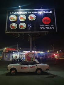 This sign advertising giant sushi rolls
