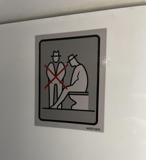 This sign in a bus bathroom forbidding an additional person from watching you poop