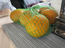 This tangerine does not look happy with his predicament
