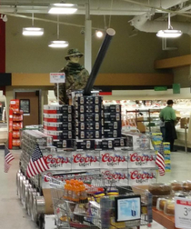 This th of July beer display is supposed to be a tank but I keep seeing something else