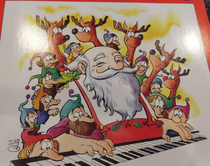 This Xmas piano book I found at work has a Santa who looks like he got Dads special brownies instead of milk amp cookies
