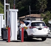 Tourist in Calistoga struggling hard at the gas pump