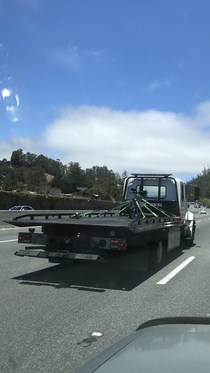 Tow truck towing a bicycle