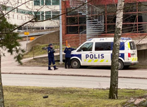 Traffic warden giving a ticket to police in Helsinki Finland