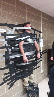 We taped our principal to the wall for a fundraiser