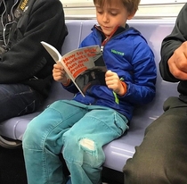 When your kid finally starts reading a book on subway rides instead of looking at his phone the whole time