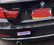 Who puts a bumper sticker on a BMW
