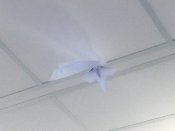  paper plane stuck in same gap I tried to throw a paper plane to knock the first one off and it got stuck
