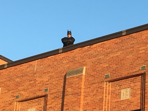  When my kids arrived at school today it was reassuring to see Batman the janitor on the roof watching over them protectively