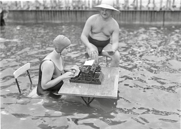 A businessman and secretary working in a pool during a heatwave in Berlin Germany July 