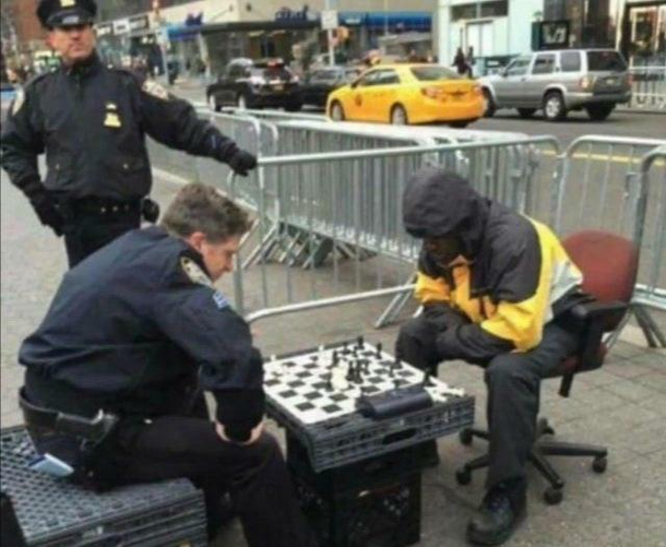 A cop beats a unarmed black man while another watches