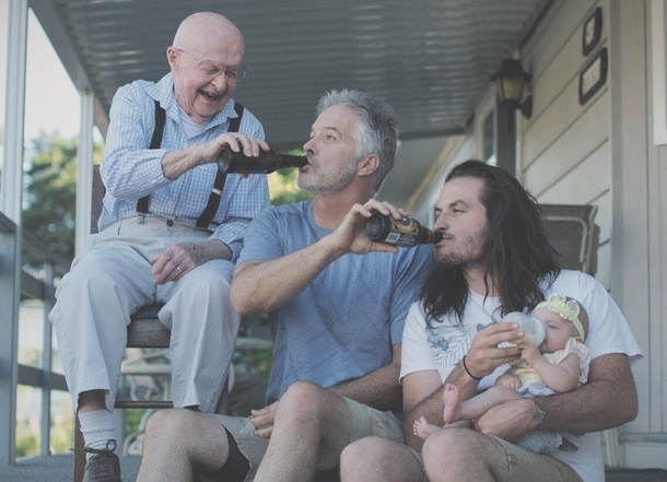 A father bottle feeding his baby