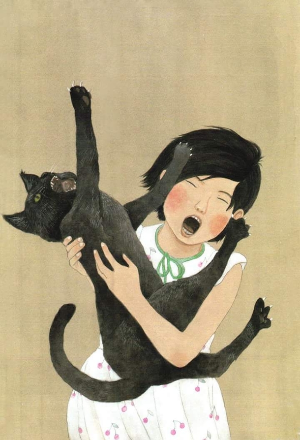 A girl and her cat enjoying each others company