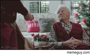 A grandson gives a meaningful Christmas card to his grandpa
