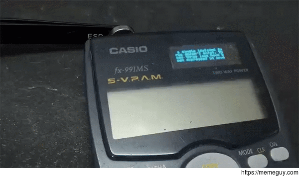 A hacked calculator with a secret screen on top of the solar charger for cheating in exams