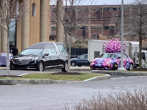 A hearse and covidmobile I saw today while on a school field trip 