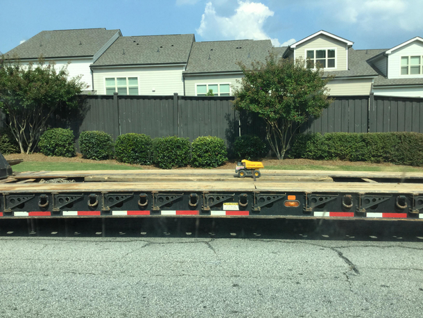 A huge truck is being hauled