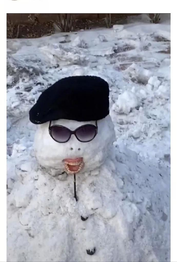 A kid took his grandmas dentures to build the snowman