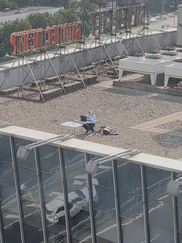A man is working next to my office Full social distancing