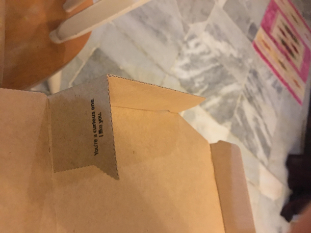 A message on the corner of my pizza box