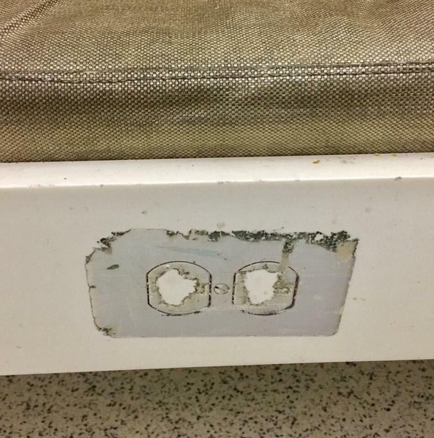 A power socket sticker at the airport