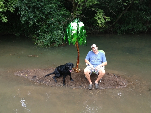 A recent flood gave us a mini island in our creek My dad is taking full advantage