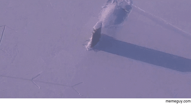 A submarine surfacing through Arctic Ice