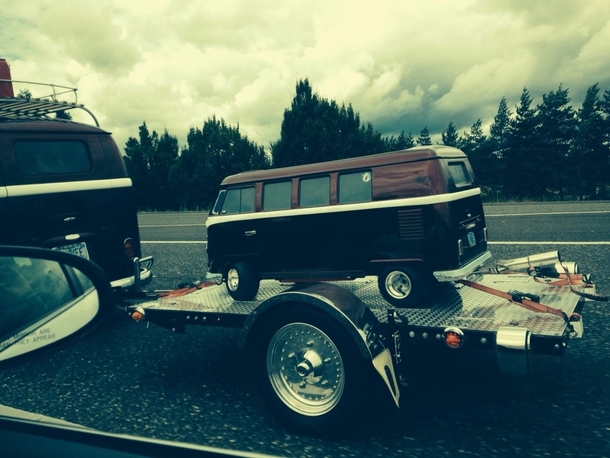 A van pulling a mini van