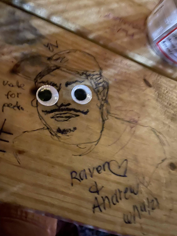 Adding googly eyes to table graffiti is pretty fantastic
