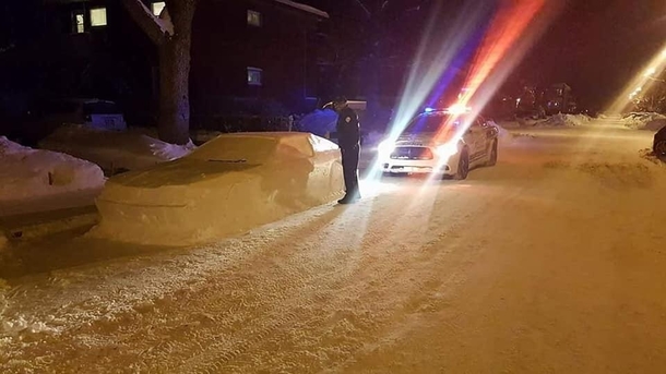 After a  inch snowstorm someone sculpted a car in the snow