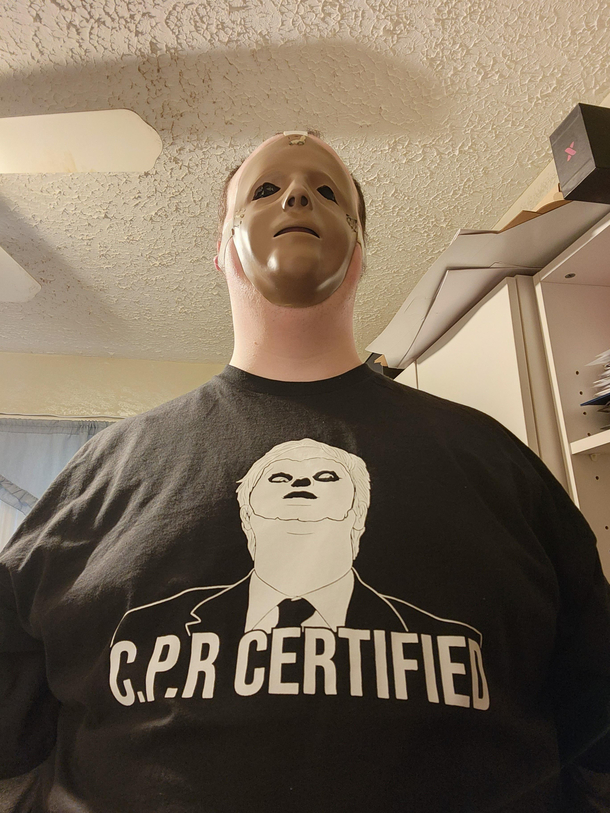 After cutting the face off a CPR doll my coworkers got me this shirt 