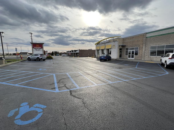 All of the parking spots in this lot are handicap spots except for the two closest spots to the door