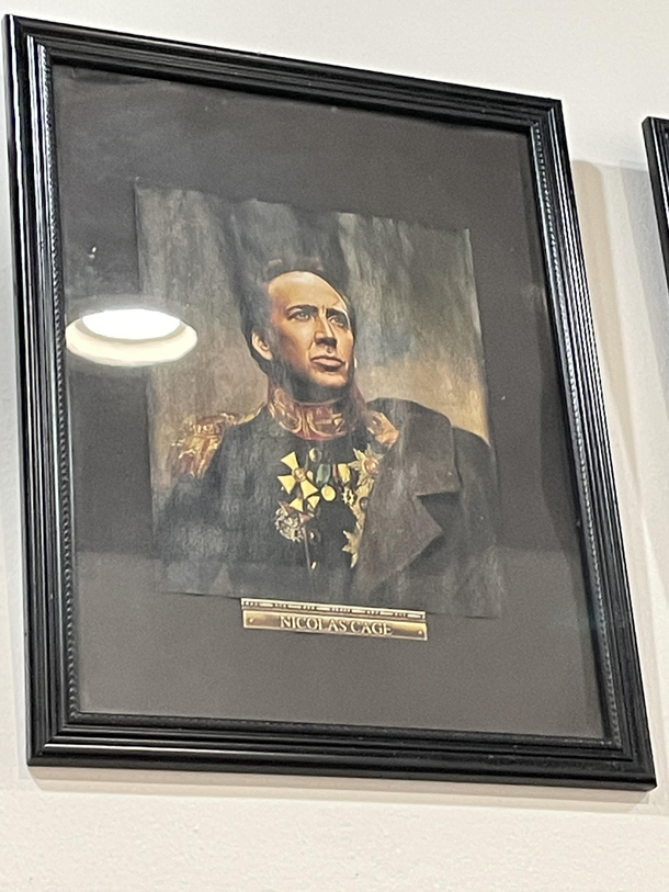 An Asian restaurant in NYC has a picture of Nic Cage in some sort of European Military uniform regalia