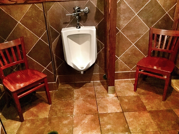 An awkward waiting area in the mens room