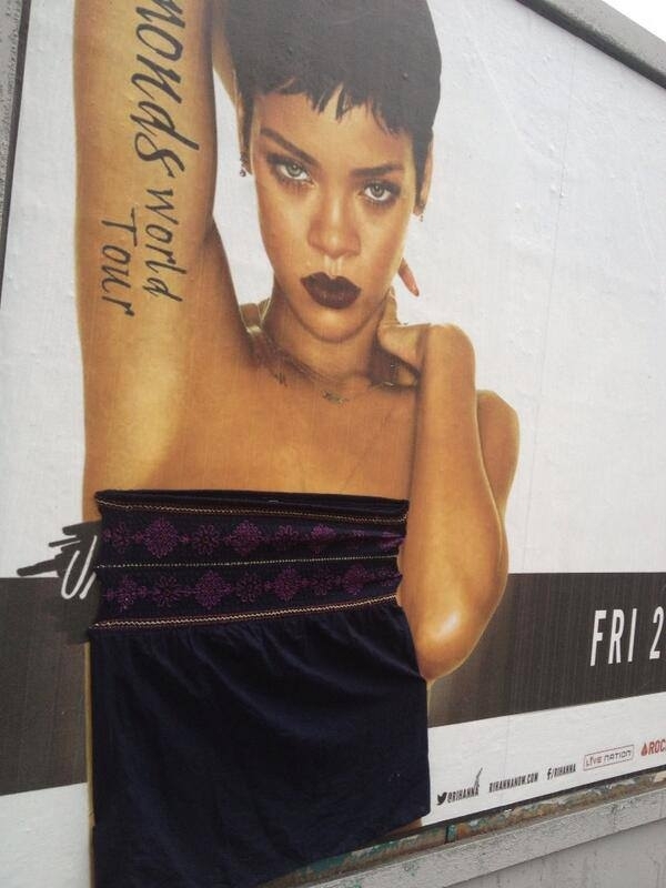 Apparently someone is going around Dublin and stapling clothes to scantily-clad Rihanna