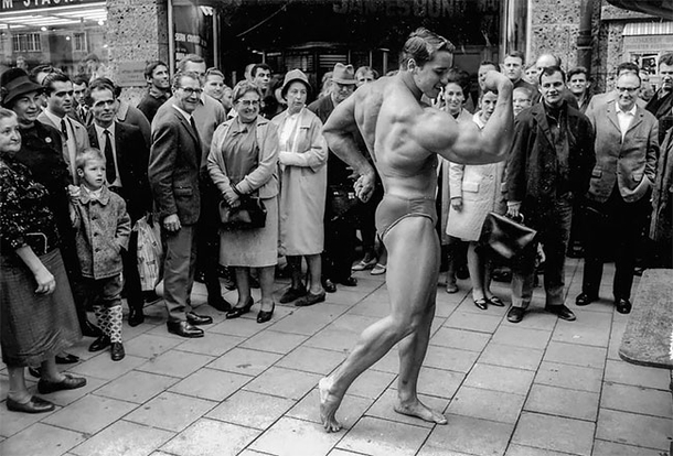 Arnold Schwarzenegger walking through Munich to promote his gym 
