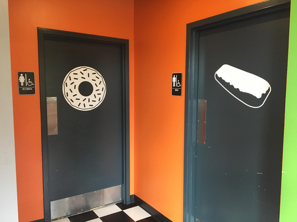 Bathroom signs at donut restaurant