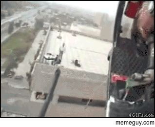 Blackwater chopper says Hi to a rooftop marksmen nest in Iraq