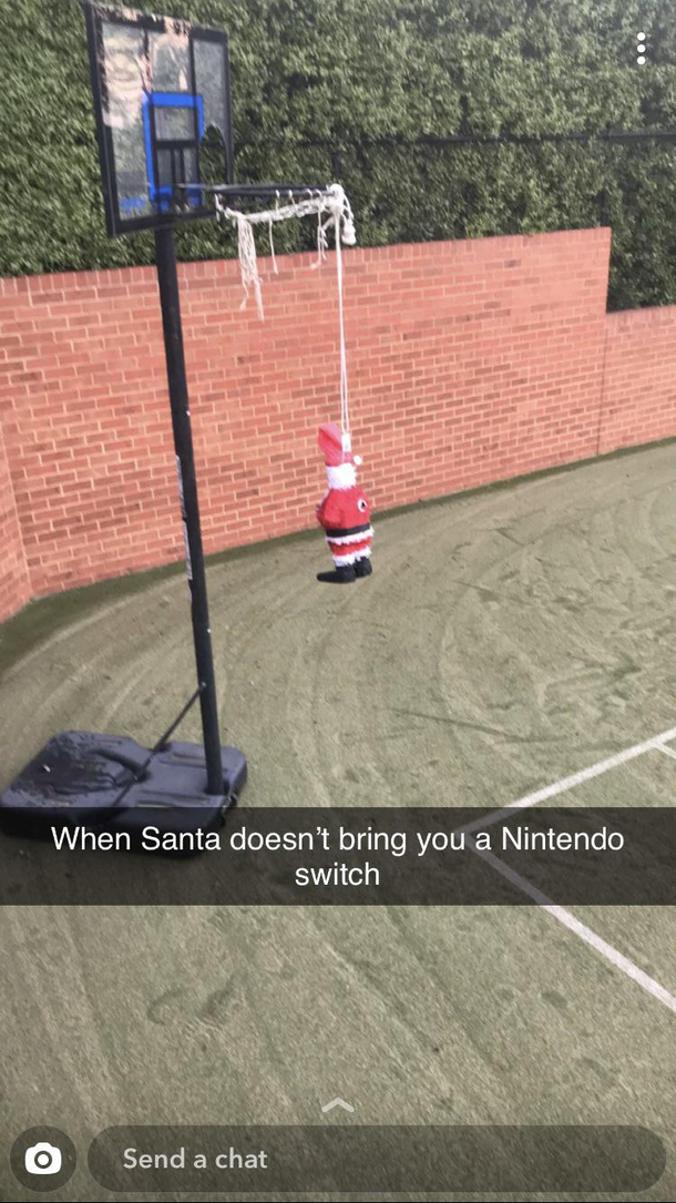 Bought a Santa shaped piata for my family for Christmas BIL sent me a nice photo of the setup