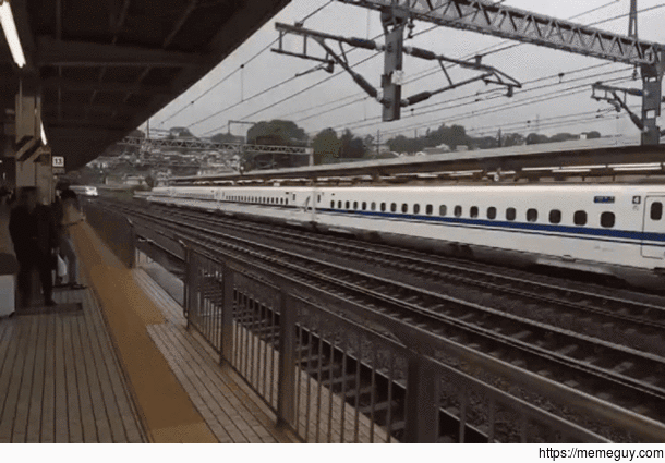 Bullet train passing at Odawara station Japan