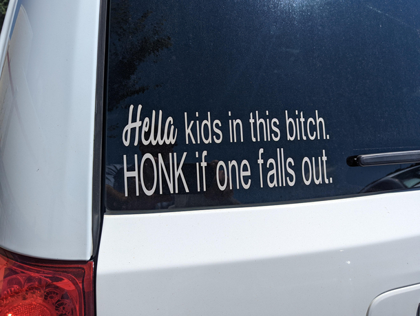 Bumper sticker on a minivan at Costco