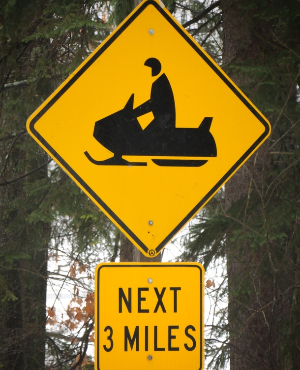 Caution Pac-Man driving snowmobile next  miles