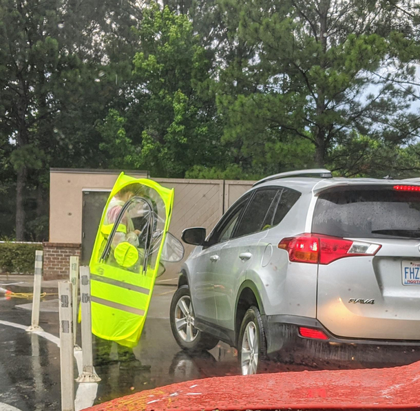 Chick-fil-A drive thru workers looking like Minions on a rainy day